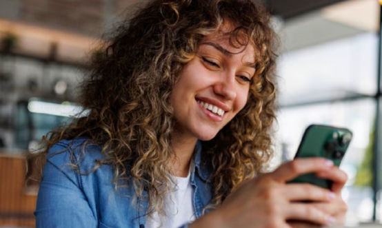 Young woman looking at mobile phone