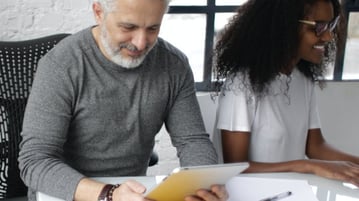 Man and woman at desk