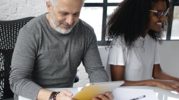 Man and woman at desk