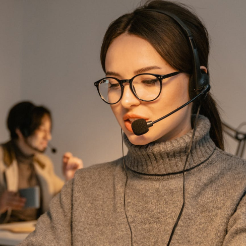 Young woman talking on headset