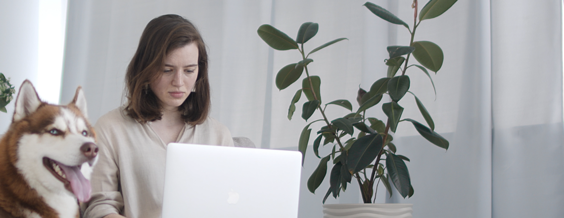 young woman looking at laptop